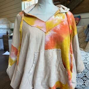 Tie day quarter length sleeve pullover jacket with a hood